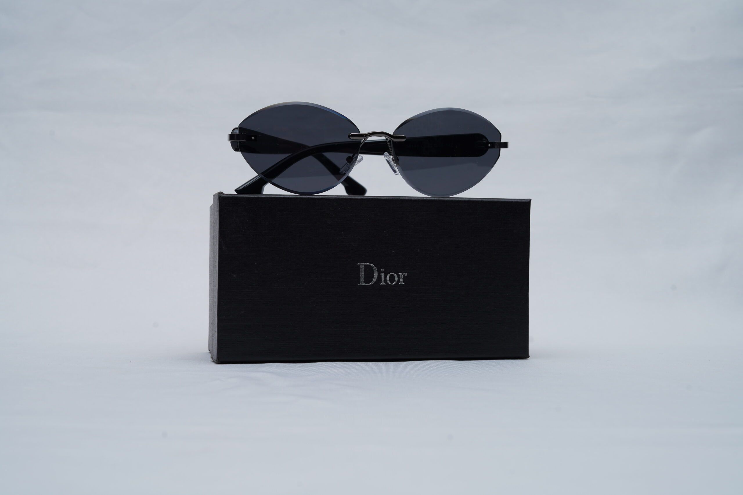 Dior Black Rimless Cat-Eye Sunglasses with Dark Tinted Lenses