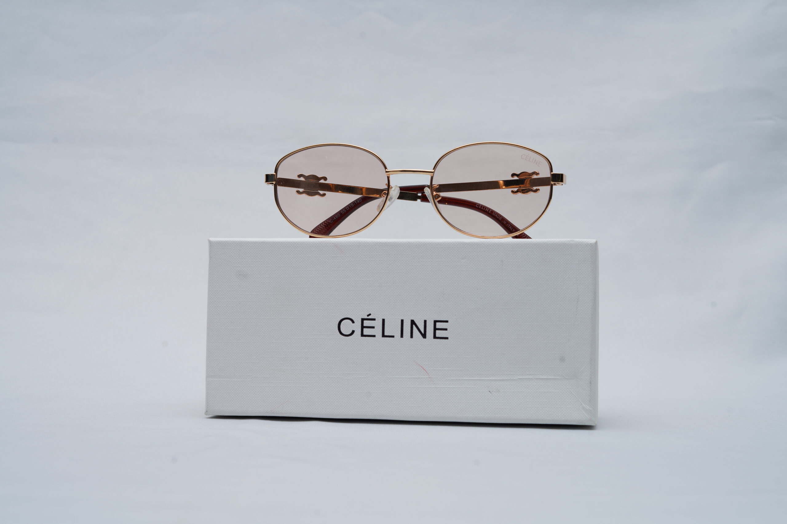 Celine Triomphe Metal Oval Sunglasses in Rose Gold and Light Pink Lenses