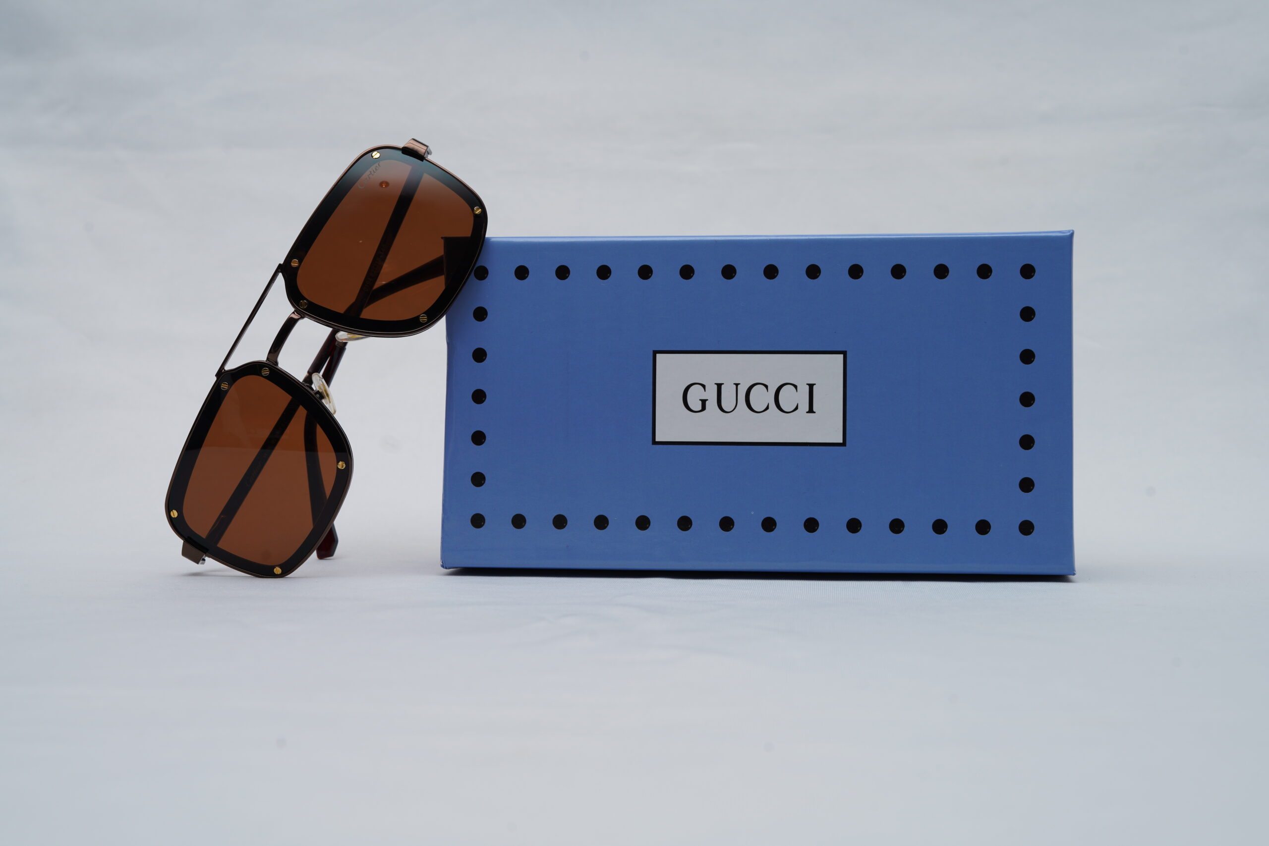 Gucci Full-Rim Navigator Sunglasses – Gold and Black with Brown Lenses