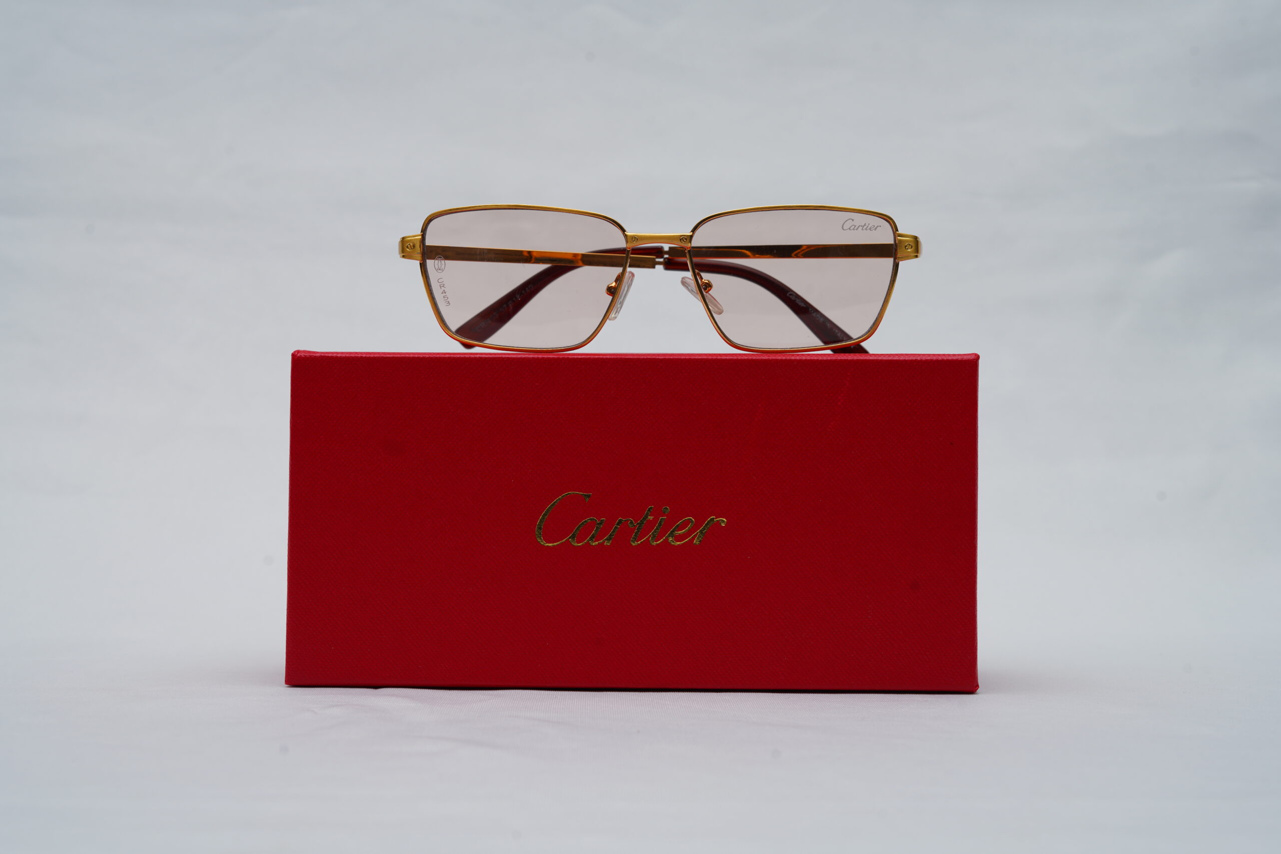 Cartier Rimless Aviator Sunglasses – Polished Gold Frame with Light Pink Lenses