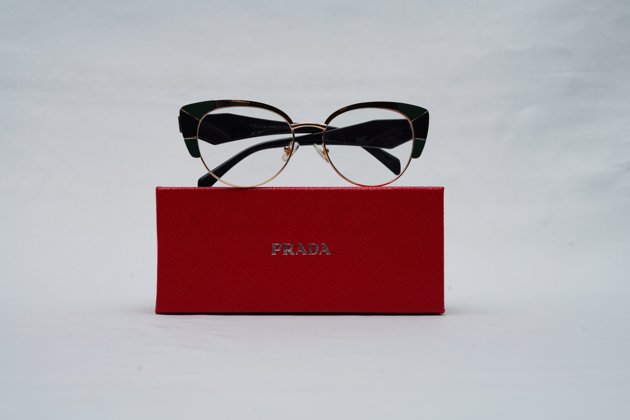 Prada Full-Rim Cat-Eye Eyeglasses – Gold Frame with Emerald Green Details