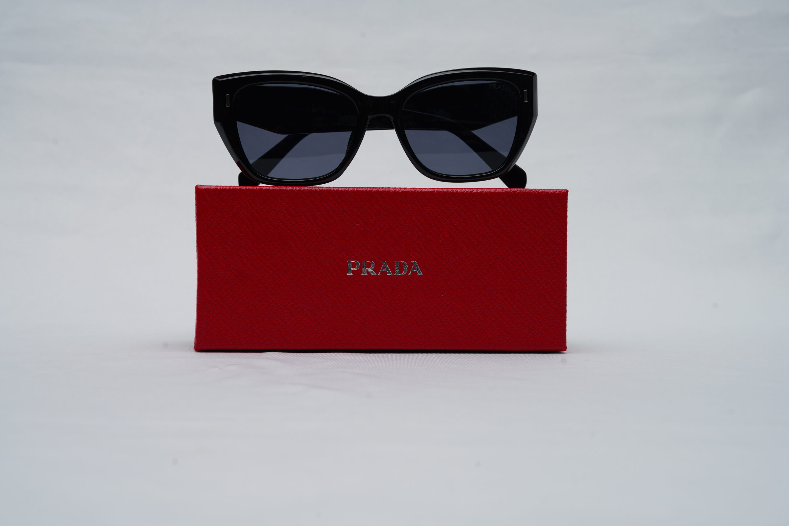 Prada Full-Rim Cat-Eye Sunglasses – Glossy Black Acetate with Dark Tint Lenses