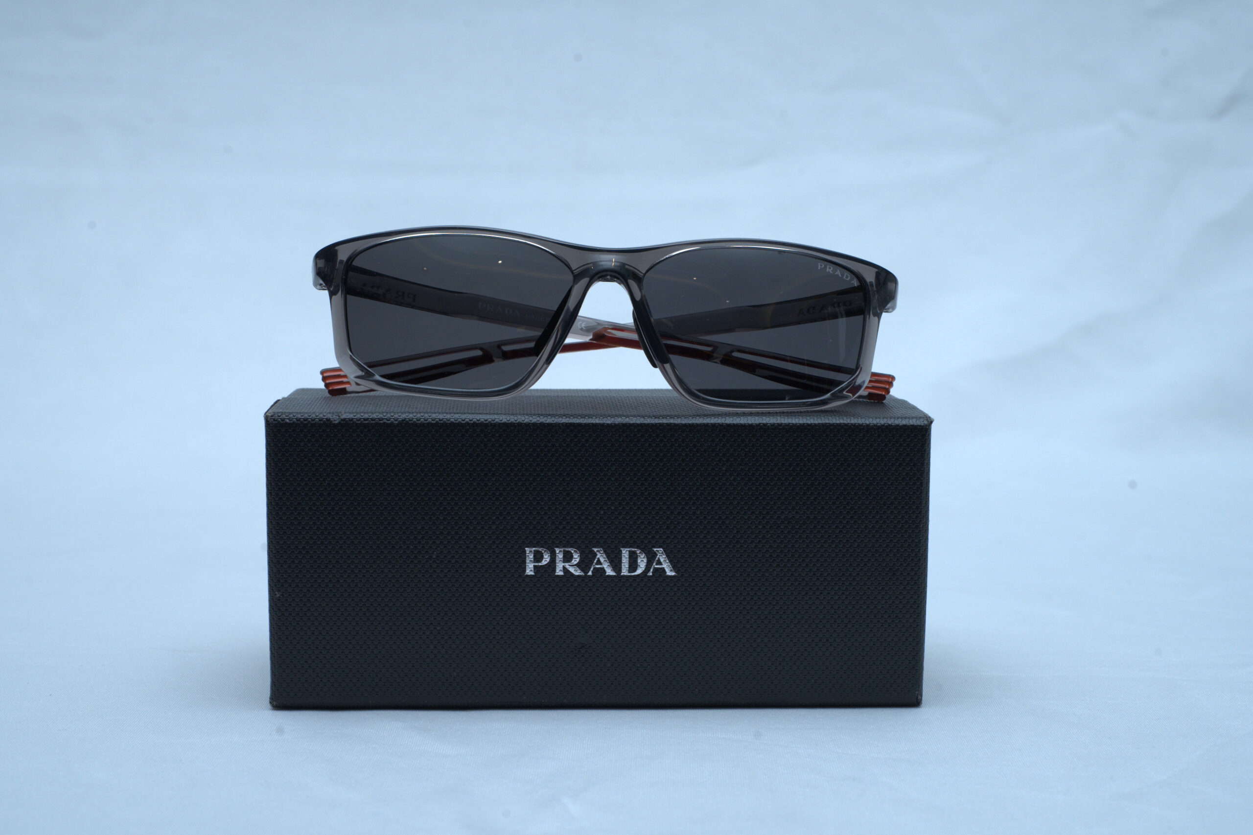 Prada Men's Linea Rossa PS 06YS Transparent Grey Rectangular Sunglasses