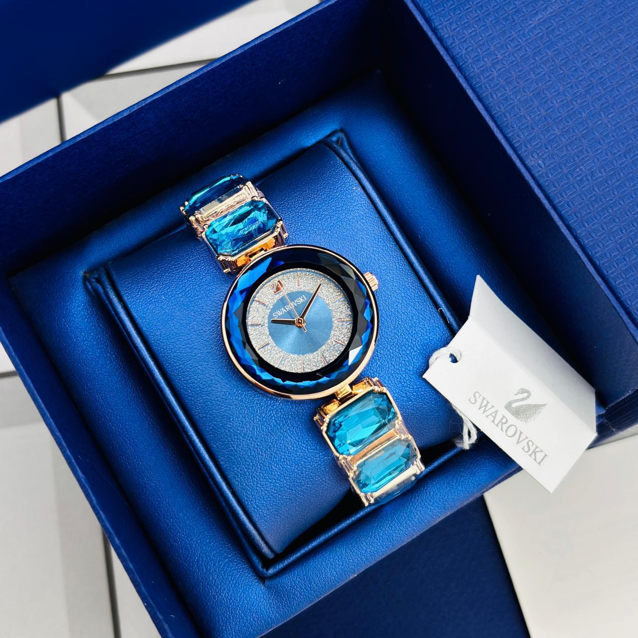 Swarovski Crystalline Delight Women's Watch with Light Blue Floating Crystals and Emerald-Cut Crystal Link Bracelet